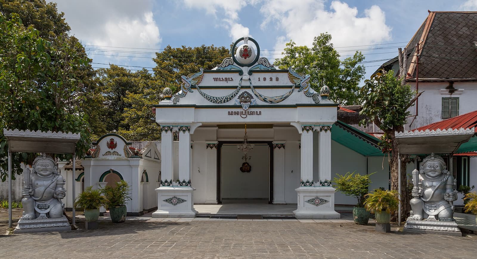 The Donopratono gate and its guardian statues at the Kraton, the sultan’s palace in Yogyakarta
