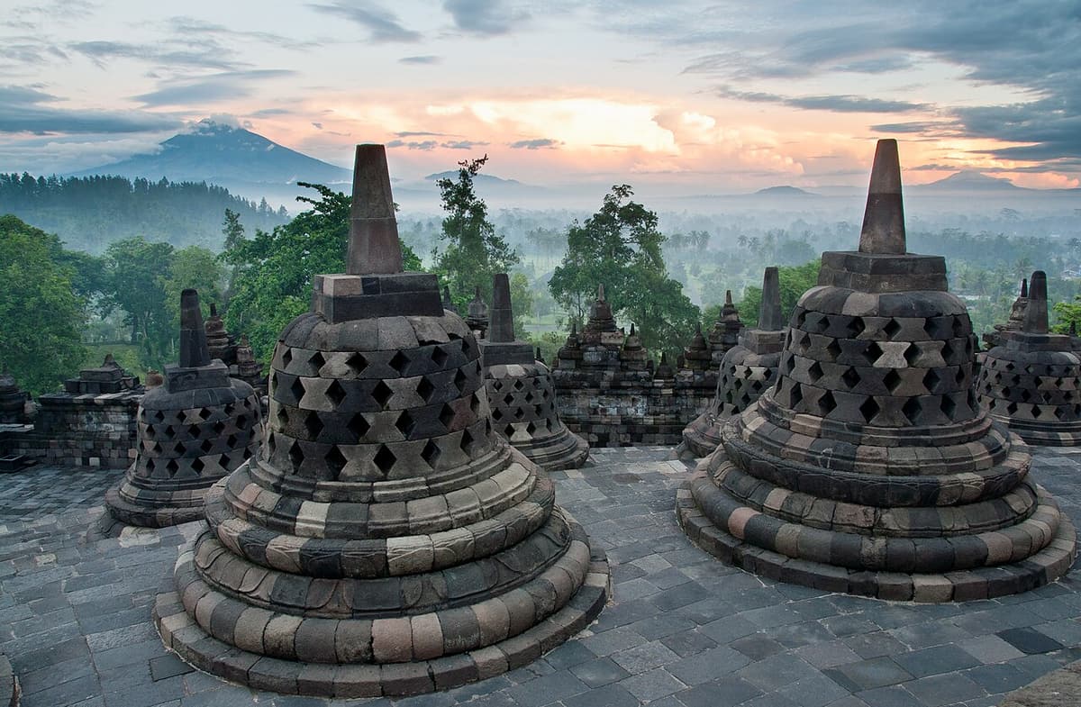 The bell-shaped stupas of Borobudur at sunrise