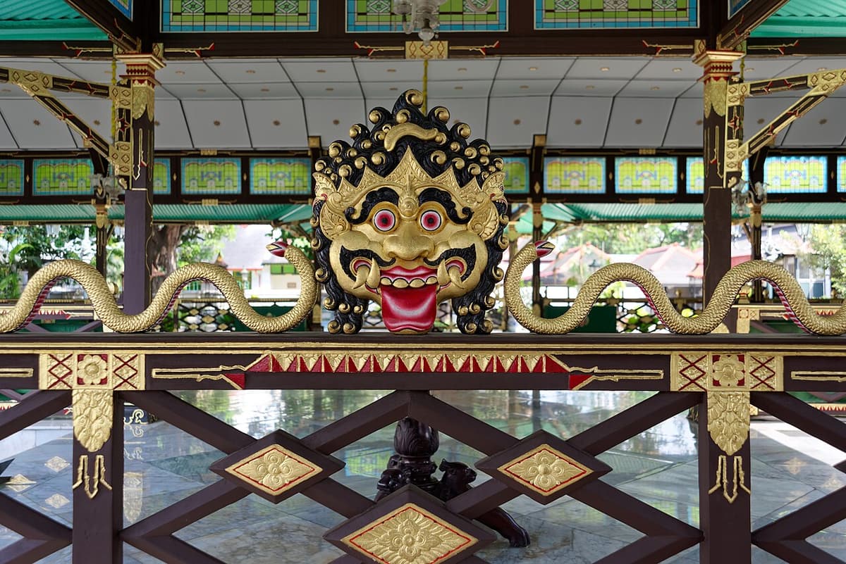 A gilded guardian mask ornament on a pavilion of the Kraton in Yogyakarta