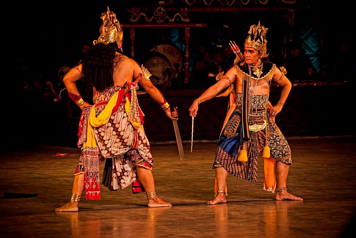Dancers in costume performing the Ramayana ballet on the open-air stage at Prambanan