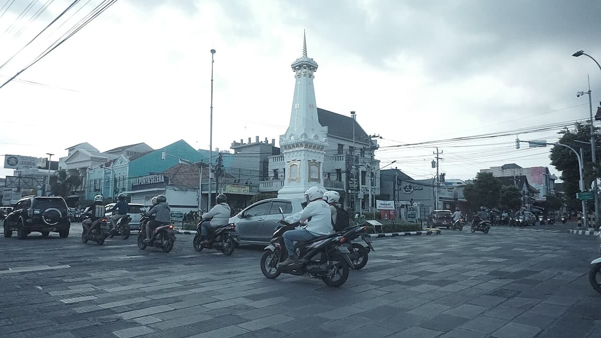 The white Tugu monument at a crossroads in central Yogyakarta